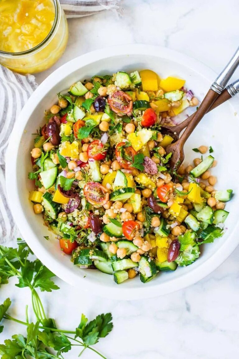 Lemon herb quinoa and chickpea bowl with fresh vegetables and lemon dressing