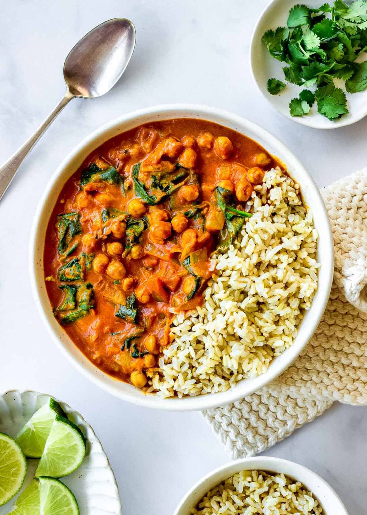 Chickpea and spinach curry with coconut milk served with rice