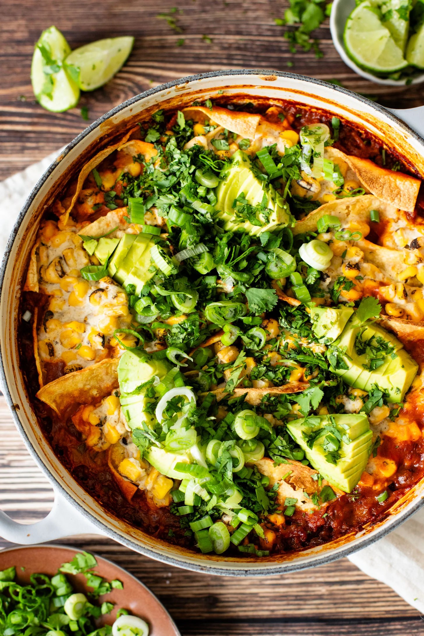 Black bean tortilla enchilada rice bake topped with crispy tortillas and vegetables
